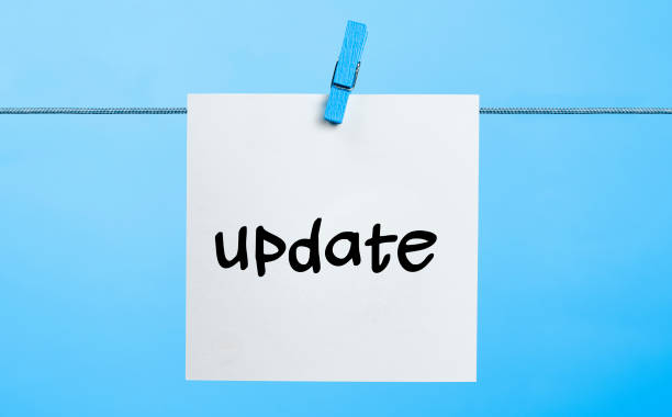 Update Concept Update Written On White Paper Hanging On Blue Background With the Latch latch photos stock pictures, royalty-free photos & images