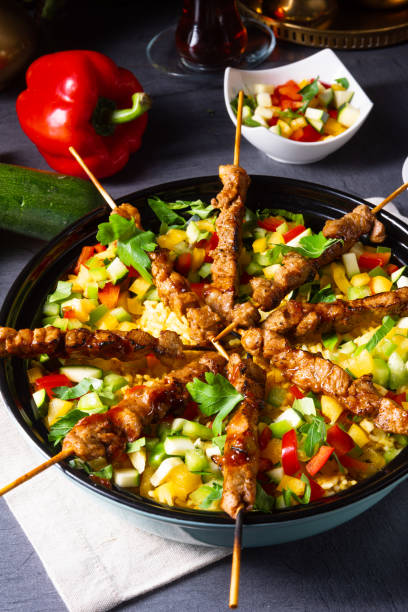 istock Lamb skewers with curry rice and different vegetables 1166771452