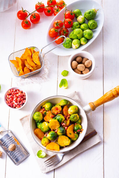 istock Brussels sprouts potato pan with bacon in rustic style 1166771953