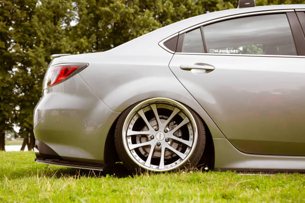 Moscow, Russia - July 13, 2019: Lowered Tuned Mazda 6 is parked on the grass.