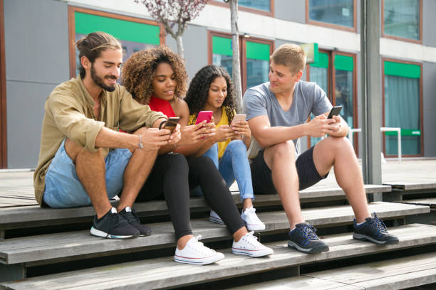 istock Happy friends meeting outside 1166773719