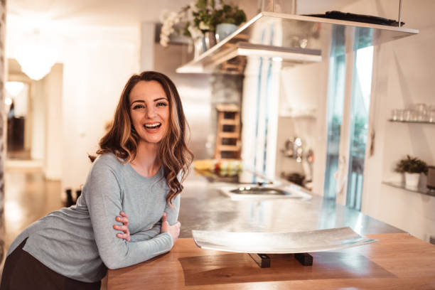 istock confidence woman at home standing 1166773961