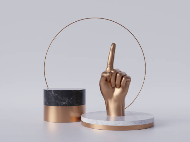 istock 3d render, golden hand, finger pointing up, recommendation concept, black marble pedestal isolated on white background, gold round frame, blank cylinder podium, simple design, luxury minimal mockup 1166774192