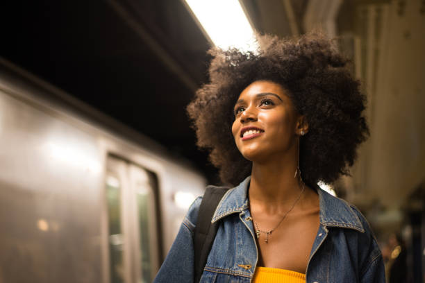 Beautiful woman in New York Happy african american woman smiling. Beautiful young female walking and having fun in New York city rush hour photos stock pictures, royalty-free photos & images