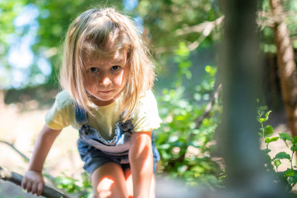 istock Girl playing in forest 1166775854