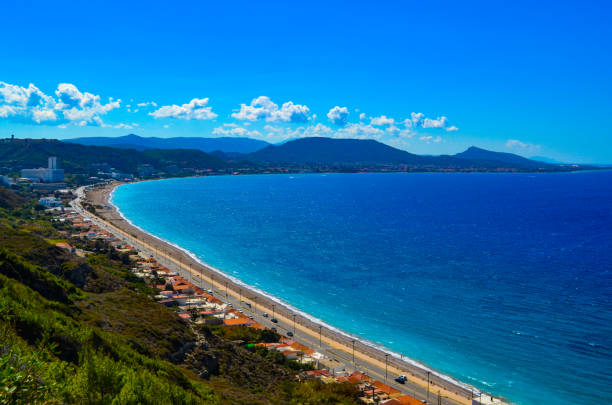 istock Coastline Of Rhodes Greece With Blue Sky and Clouds 1166776043