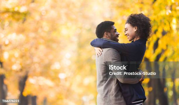 Loving Couple Hugging And Looking Into Each Other Eyes Stock Photo - Download Image Now
