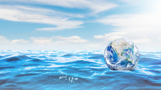 istock Ecology and Pollution Concept : Blue planet earth globe floating on blue water. 1166777943