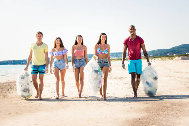 istock Volunteers collecting plastic on the beach 1166777963