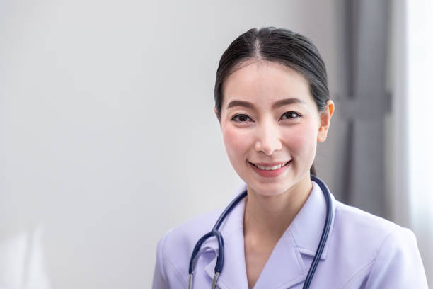 istock Portrait of a smiling asian nurse looking camera 1166777965