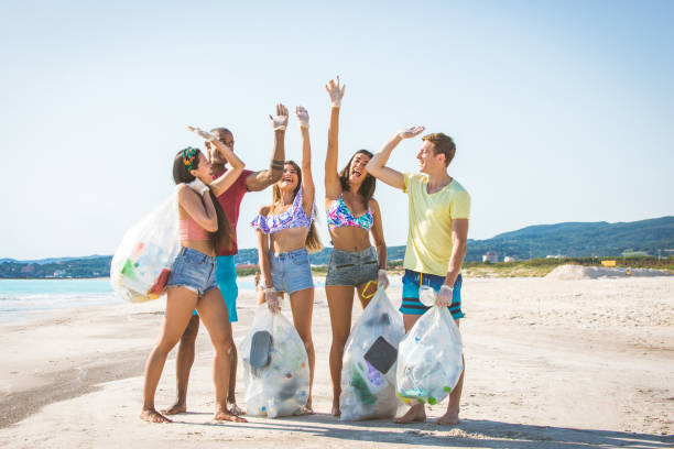 istock Volunteers collecting plastic on the beach 1166778001