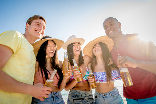 istock Friends having fun on the beach 1166778979