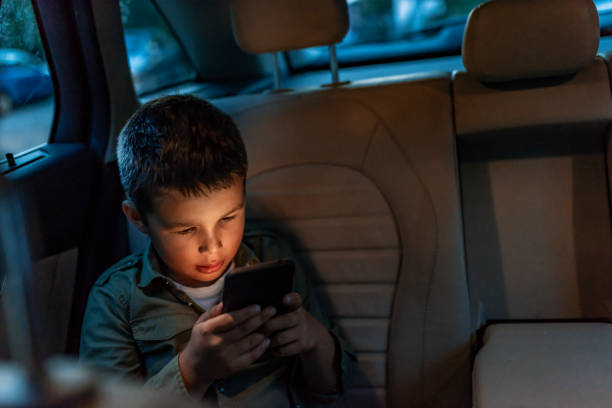 istock Playing on smart phone in the car 1166779014