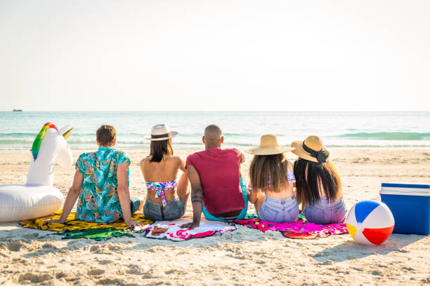 istock Friends having fun on the beach 1166780519