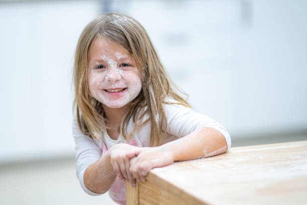 istock Girl with flour on face 1166780597