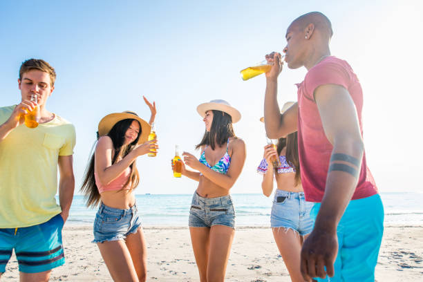 istock Friends having fun on the beach 1166780762