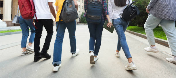 istock Unrecognizable teenage students in high school campus 1166780821