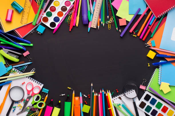 istock Modern school stationery on black board with blank space 1166781680