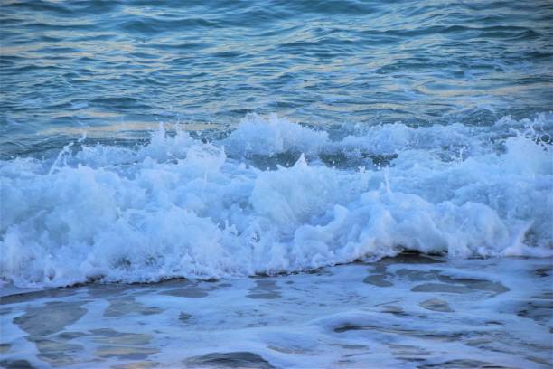 istock Sea ocean waves beach sand closeup water 1166781924