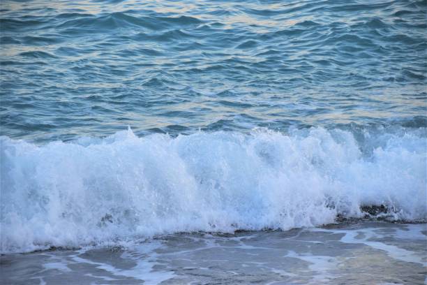 istock Sea ocean waves beach sand closeup water 1166782143