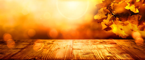 istock Wooden table with colorful autumn leaves 1166782146