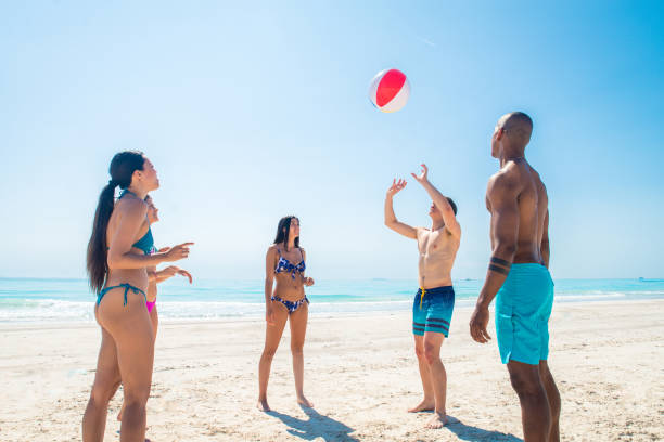 istock Friends having fun on the beach 1166782166