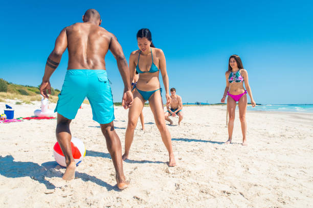 istock Friends having fun on the beach 1166782182