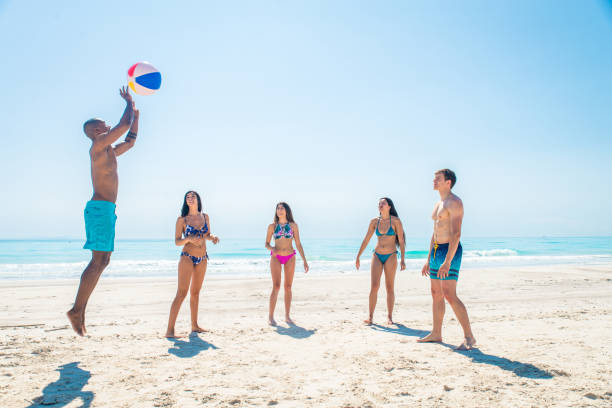 istock Friends having fun on the beach 1166782295
