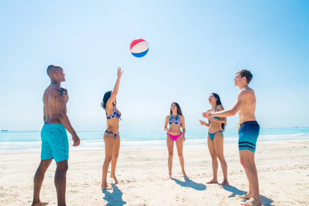 istock Friends having fun on the beach 1166782437