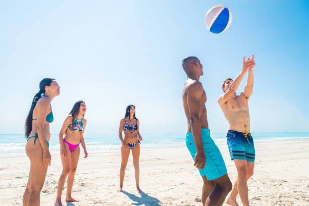 istock Friends having fun on the beach 1166782471