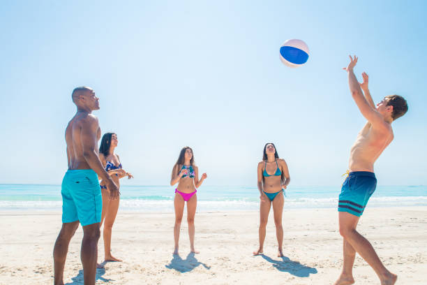 istock Friends having fun on the beach 1166783314