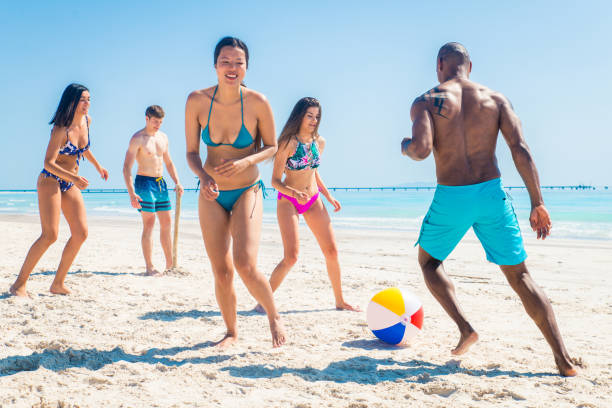istock Friends having fun on the beach 1166783885