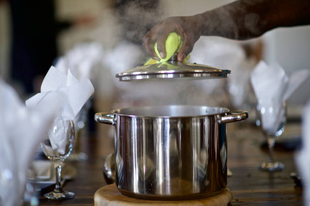 Steam as Lifting the metal pot lid