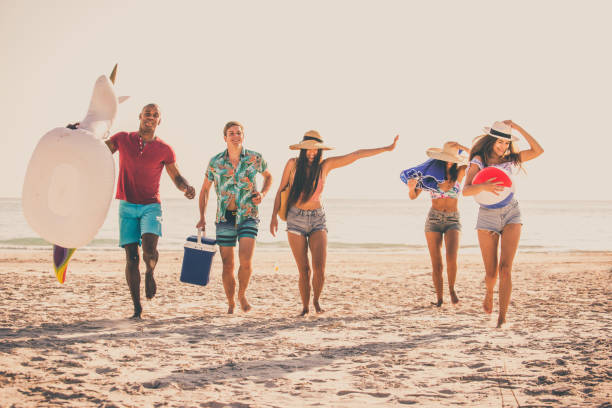 istock Friends having fun on the beach 1166786497