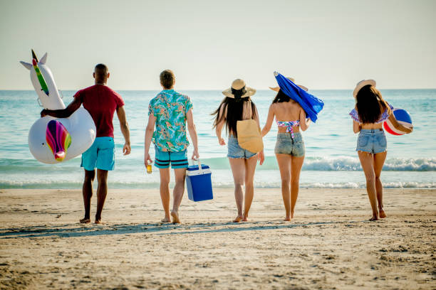 istock Friends having fun on the beach 1166786733