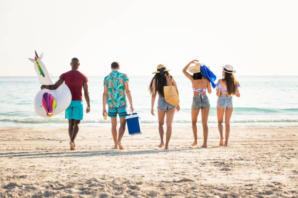 istock Friends having fun on the beach 1166786787