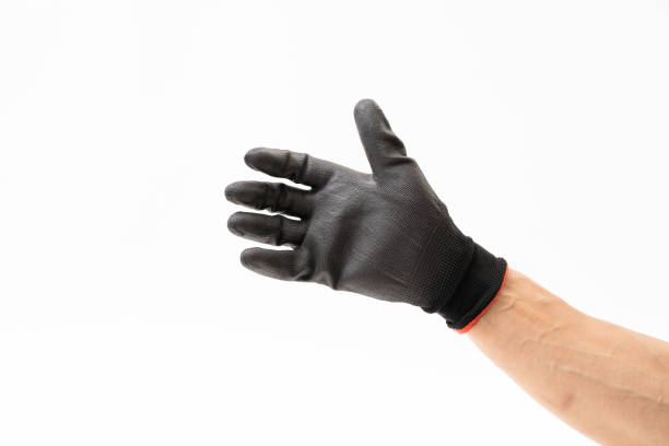 istock Man hand with black rubber glove on white background 1166788014