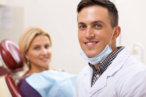 istock Young male dentist working at his clinic 1166788126