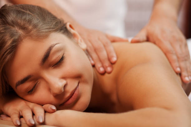 istock Beautiful woman getting massage 1166789106