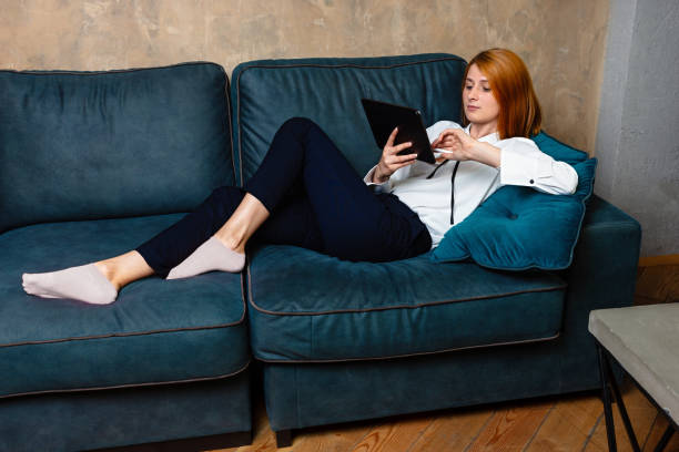 istock Young Successful Business woman Using Digital Tablet at home. 1166789165