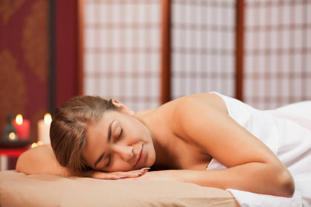 istock Beautiful woman getting massage 1166789452