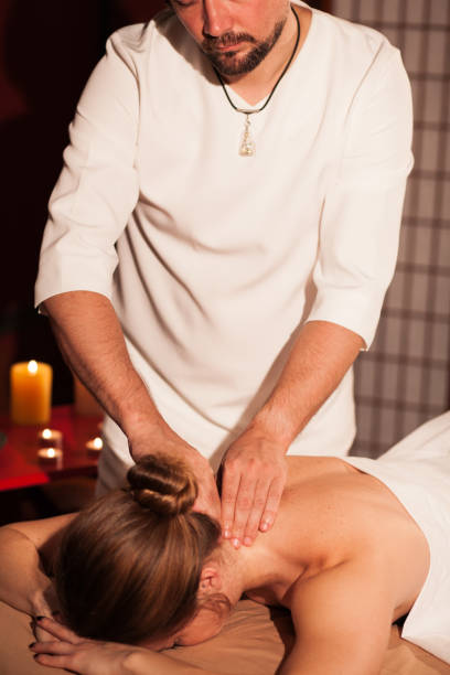 istock Beautiful woman getting massage 1166789593