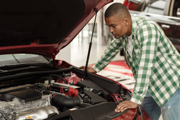 istock Handsome African man buying new car 1166790012