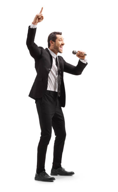 istock Man in a suit with a microphone pointing up 1166790572