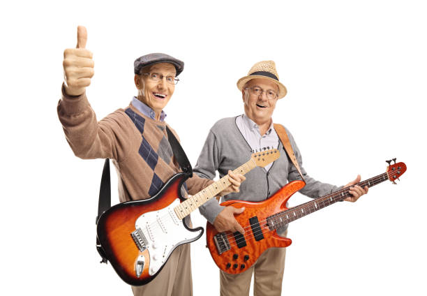 istock Two elderly men with electric guitars showing thumbs up 1166790847