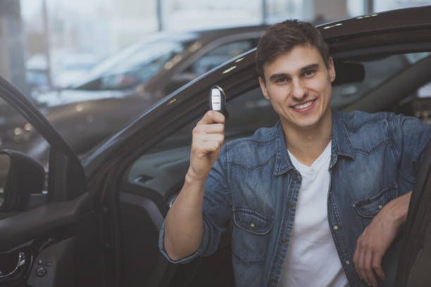 istock Handsome man choosing new automobile to buy 1166791461