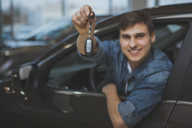 istock Handsome man choosing new automobile to buy 1166791482