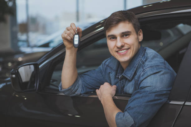 istock Handsome man choosing new automobile to buy 1166791484