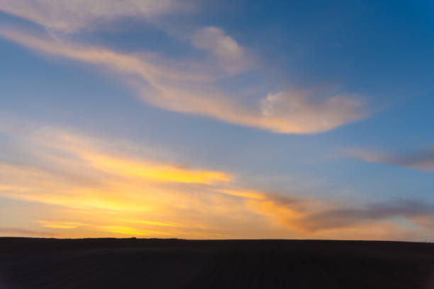 Farmland, hill with blue sky background in dusk. Silhouette view nature landscape.