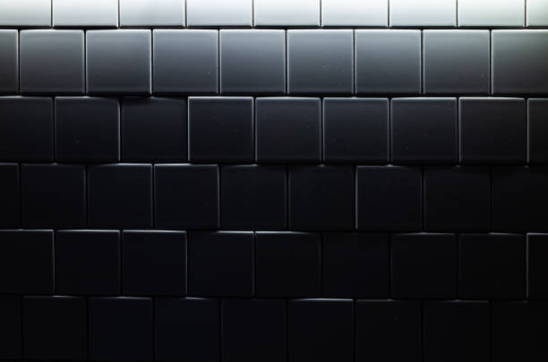 istock Tiled wall in dark room with blue illumination 1166796914